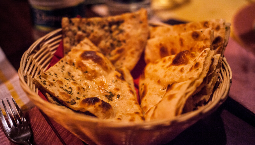 Soft and leavened oven-baked flatbread brushed with a generous layer of melted butter.