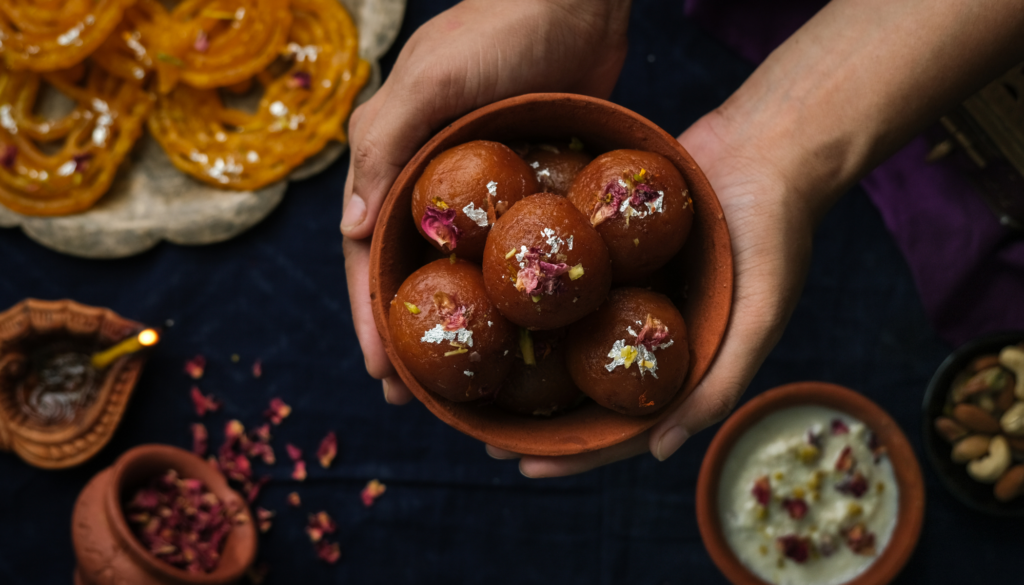 Soft, deep-fried milk balls soaked in rose-scented sugar syrup—warm, rich and comforting.