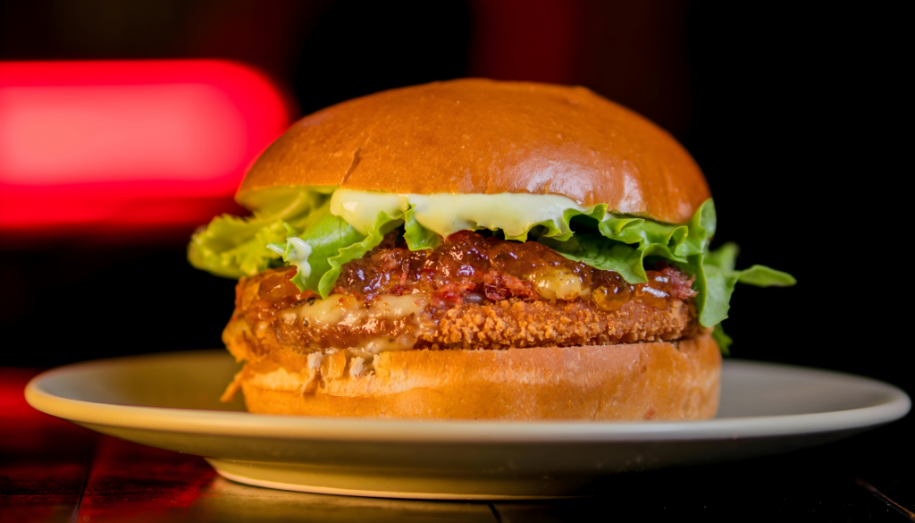 A hearty vegetable patty made with fresh seasonal veggies and mild spices, grilled to perfection and served in a soft toasted bun with crisp lettuce, ripe tomatoes, and our signature sauce.